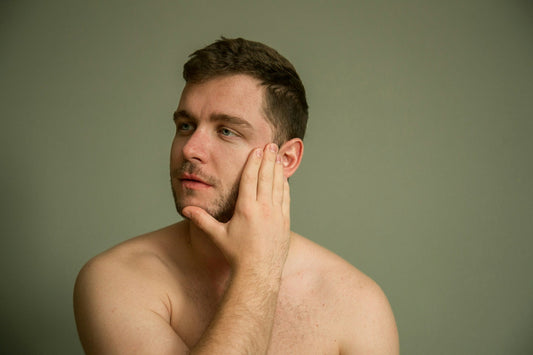 applying serum to men skin face