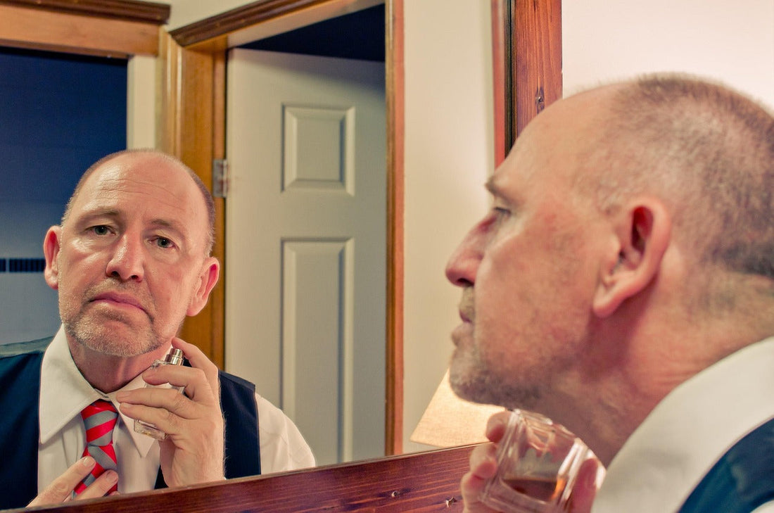 old men in bathroom using retinal serum